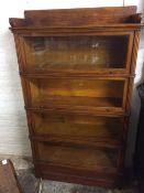 A rare & early Globe Wernicke mahogany sectional bookcase with reeded columns & stamped