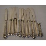 Various butter knives with silver handles/collars