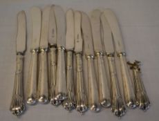 Various butter knives with silver handles/collars