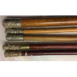 4 Lincolnshire Regiment swagger sticks & a cylinder top swagger stick