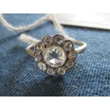 Tested as 18ct gold central rose cut diamond cluster ring with surrounding smaller diamonds,
