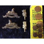 Pair of Lincolnshire regiment brass collar badges,