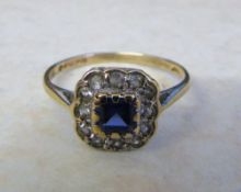 9ct gold ring with central square cut sapphire surrounded by white quartz size M (total weight 1.