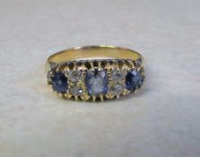 Tested as 18ct gold diamond and sapphire ring size K/L (total weight 3.