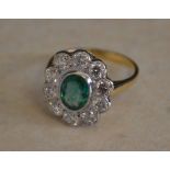 18ct gold emerald and diamond daisy ring,