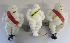 3 small Michelin men figures