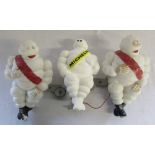 3 small Michelin men figures