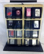 Ex-shop stock 16 Zippo lighters in lockable display cabinet