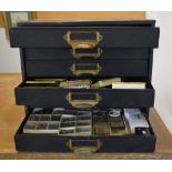 Watchmakers cabinet full of parts, pocket watches, movements,
