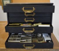 Watchmakers cabinet full of parts, pocket watches, movements,