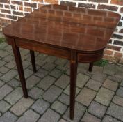 Georgian mahogany fold over breakfast table with box wood stringing on tapering legs