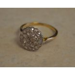 Tested as 18ct gold diamond cluster ring,
