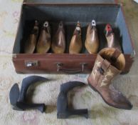 Suitcase containing shop display ceramic cowboy boot,