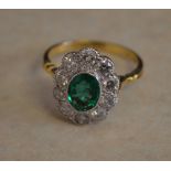 18ct gold emerald and diamond daisy ring,