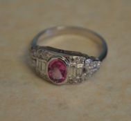 18ct white gold pink sapphire ring with ornate diamond shoulders,