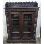 Victorian heavily carved oak display cabinet reputedly purchased at the auction of the contents of