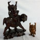 2 carved wooden figures of Buda (both with damage to hands)