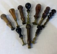 10 19th & early 20th century brass & wooden handle pastry jiggers