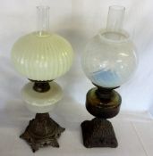 2 Victorian paraffin lamps on cast iron bases