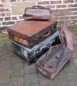 Assorted vintage suitcases with tourist lables,