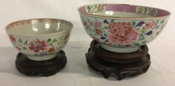 2 18th century Chinese famille rose porcelain bowls on wooden stands