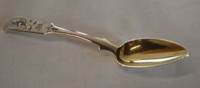 An ornate Russian silver and niello work fiddle and shell pattern dessert spoon, makers mark 'A.