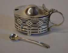 Silver salt with blue liner and non matching silver spoon,