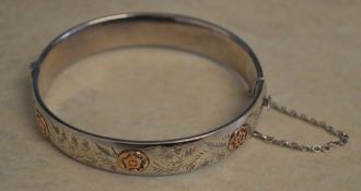 Silver bangle with safety chain, approx weight 0.