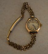 Record 9ct gold body wristwatch on a rolled gold strap