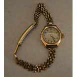 Record 9ct gold body wristwatch on a rolled gold strap