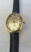 Ladies 9ct gold cased Accurist wrist watch with leather strap