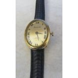 Ladies 9ct gold cased Accurist wrist watch with leather strap