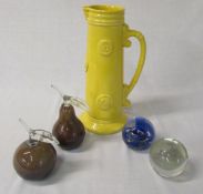 4 paperweights and a yellow jug
