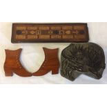 Carved wooden printing block depicting a lion with the sun on its back,