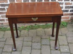 Georgian mahogany fold over breakfast table on pad feet