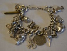 Silver charm bracelet with mixed silver and white metal charms