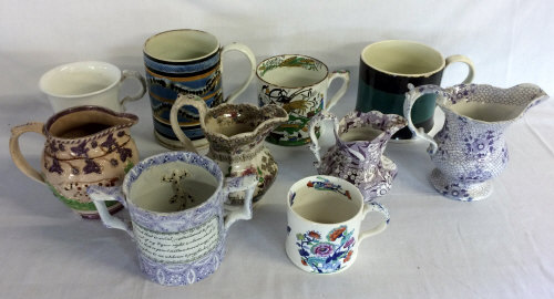 10 19th century jugs & tankards including a motto mug with a lizard & frog on inside (A/F)