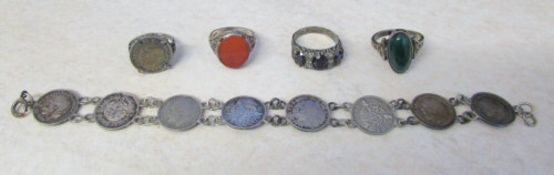 Selection of silver rings & a threepence coins silver bracelet