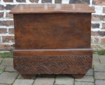 Indian style carved wooden travelling chest raised on wheels