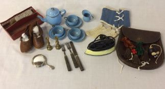 Various early 20th century doll accessories including an enamel tea set, iron, cutlery,