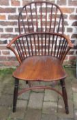 19th century Windsor chair with yew wood arms and back and an elm seat and crinoline stretcher