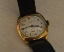9ct gold body Taurex wristwatch on a leather strap,