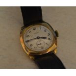 9ct gold body Taurex wristwatch on a leather strap,