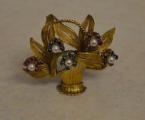 Tested as 18ct gold brooch in the shape of a bouquet of flowers, featuring pearls, small rubies,