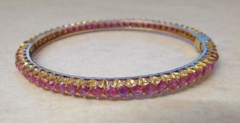 18ct gold 6 ct total pink ruby bangle weight 16.