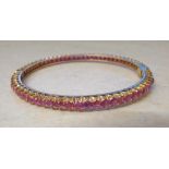 18ct gold 6 ct total pink ruby bangle weight 16.