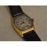 9ct gold body J W Benson wristwatch on a leather strap,