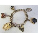 9ct gold charm bracelet with 9ct gold fobs etc total weight 58.