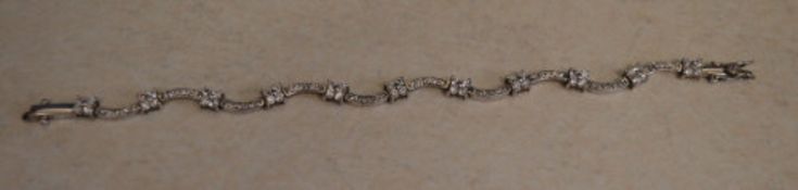 Attractive silver and cubic zirconia flower bracelet, total approx weight 10.