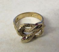 9ct gold ring consisting of two entwined serpents weight 4.